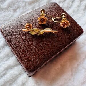 Krementz rose gold colored earrings with a clasp